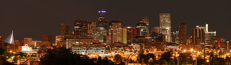 The skyline of downtown Denver with Speer Boulevard in the foreground